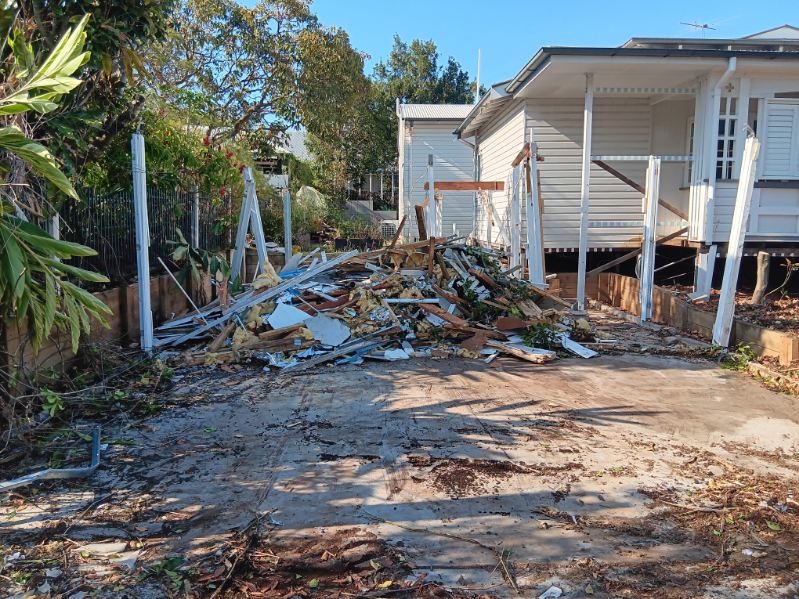 Driveway roof demolition ready for clearing.